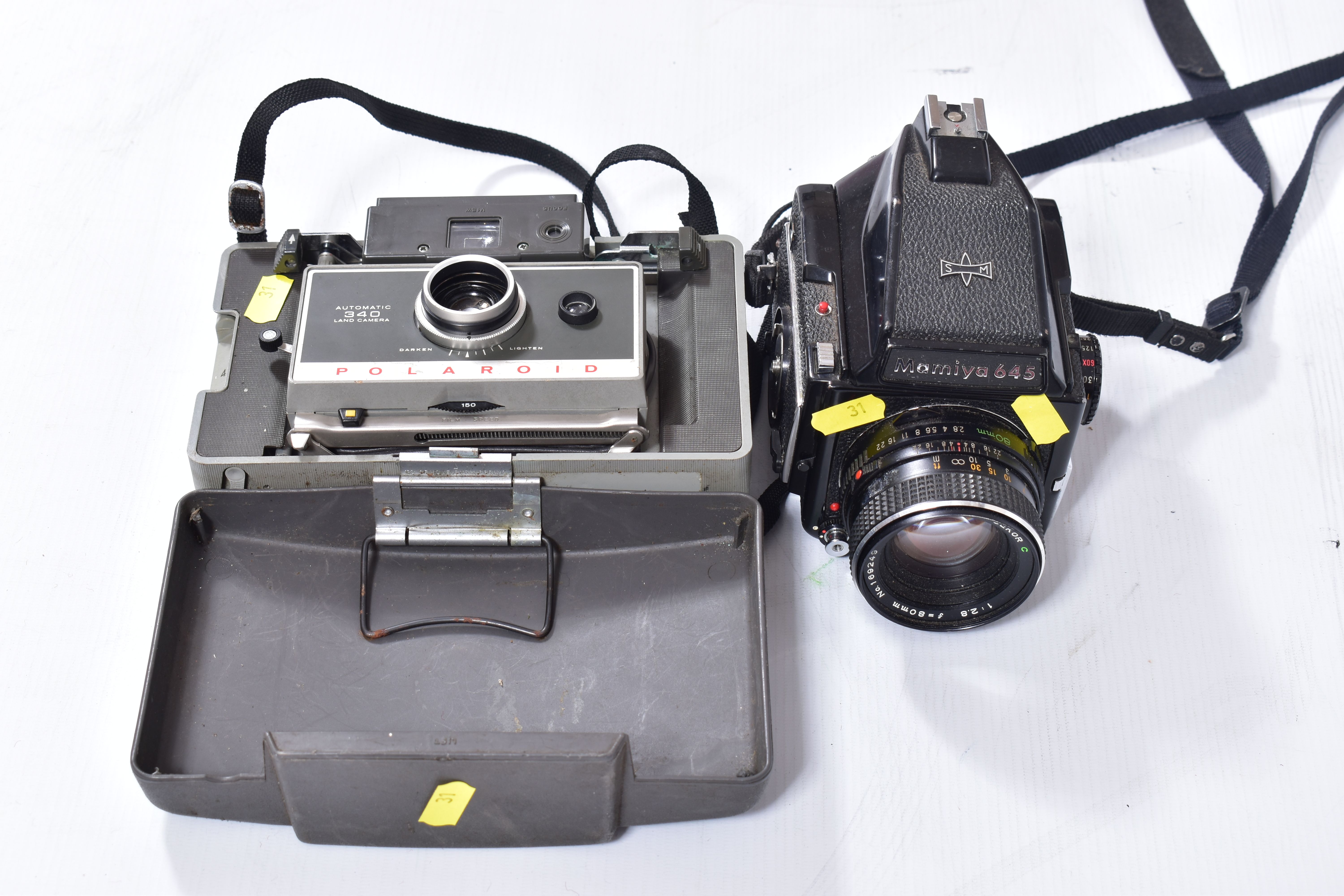 A MAMIYA M645 1000S MEDIUM FORMAT CAMERA fitted with a Sekor C 80mm f2.8 lens ( missing winding