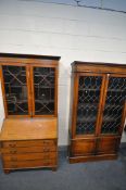 A 20TH CENTURY OAK LEAD GLAZED TWO DOOR BOOKCASE, enclosing three adjustable shelves, above two