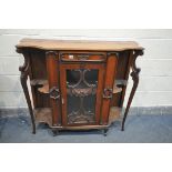 AN EDWARDIAN WALNUT SIDEBOARD, with a single drawer, above an single glazed door, flanked by