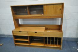 A MID CENTURY SWEEDISH MODULAR EXTENDING WALL UNIT, comprising cupboards, drawers and shelves,