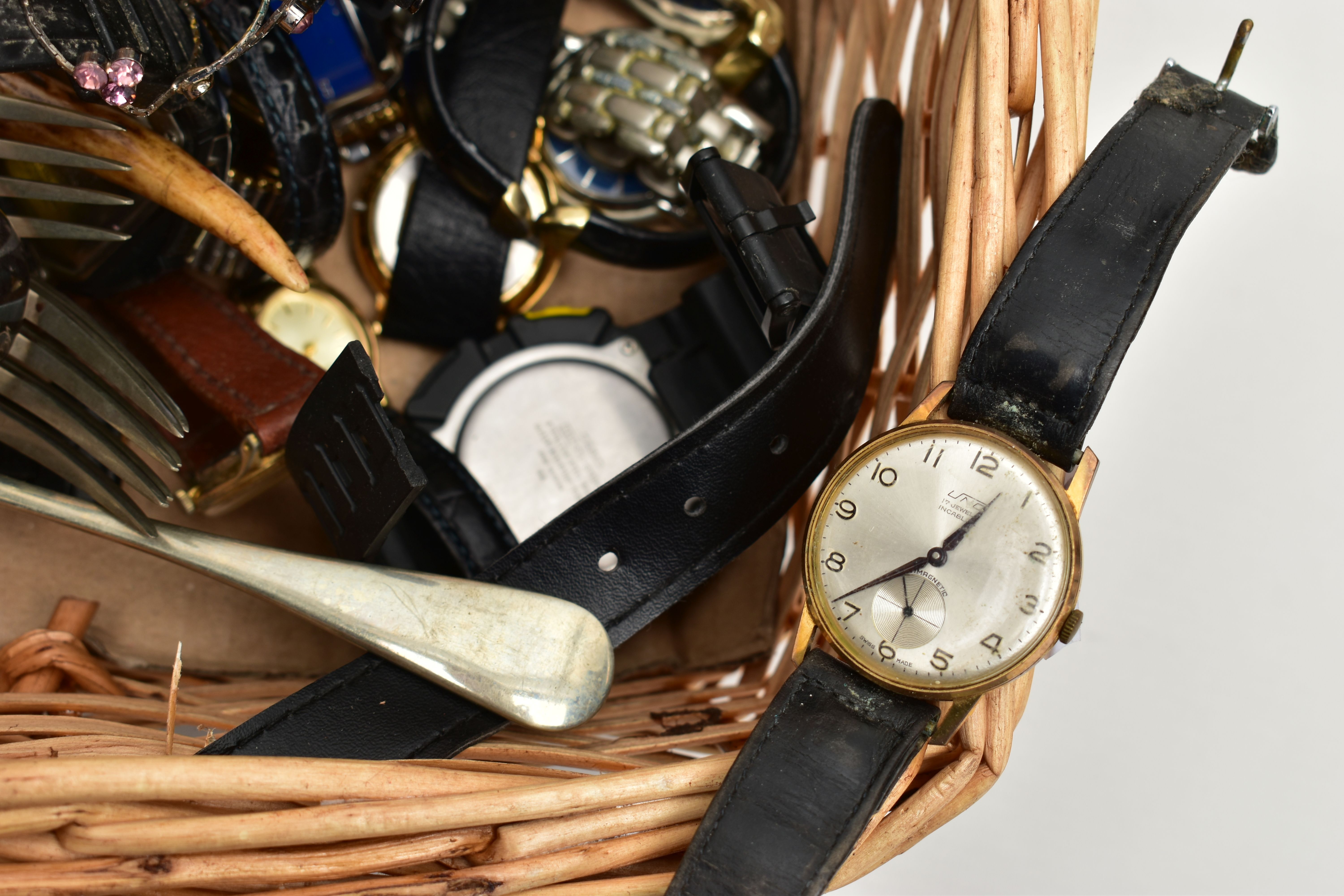 A WICKER BASKET WITH ITEMS, items to include various ladies and gents fashion wristwatches mostly - Image 4 of 4