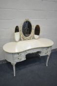 A CREAM FRENCH KIDNEY DRESSING TABLE, with triple mirrors, length 136cm x depth 54cm x height 132cm