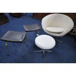 A BEIGE UPHOLSTERED SWIVEL EGG CHAIR, along with a pair of mid-century stag dressing stools, and a