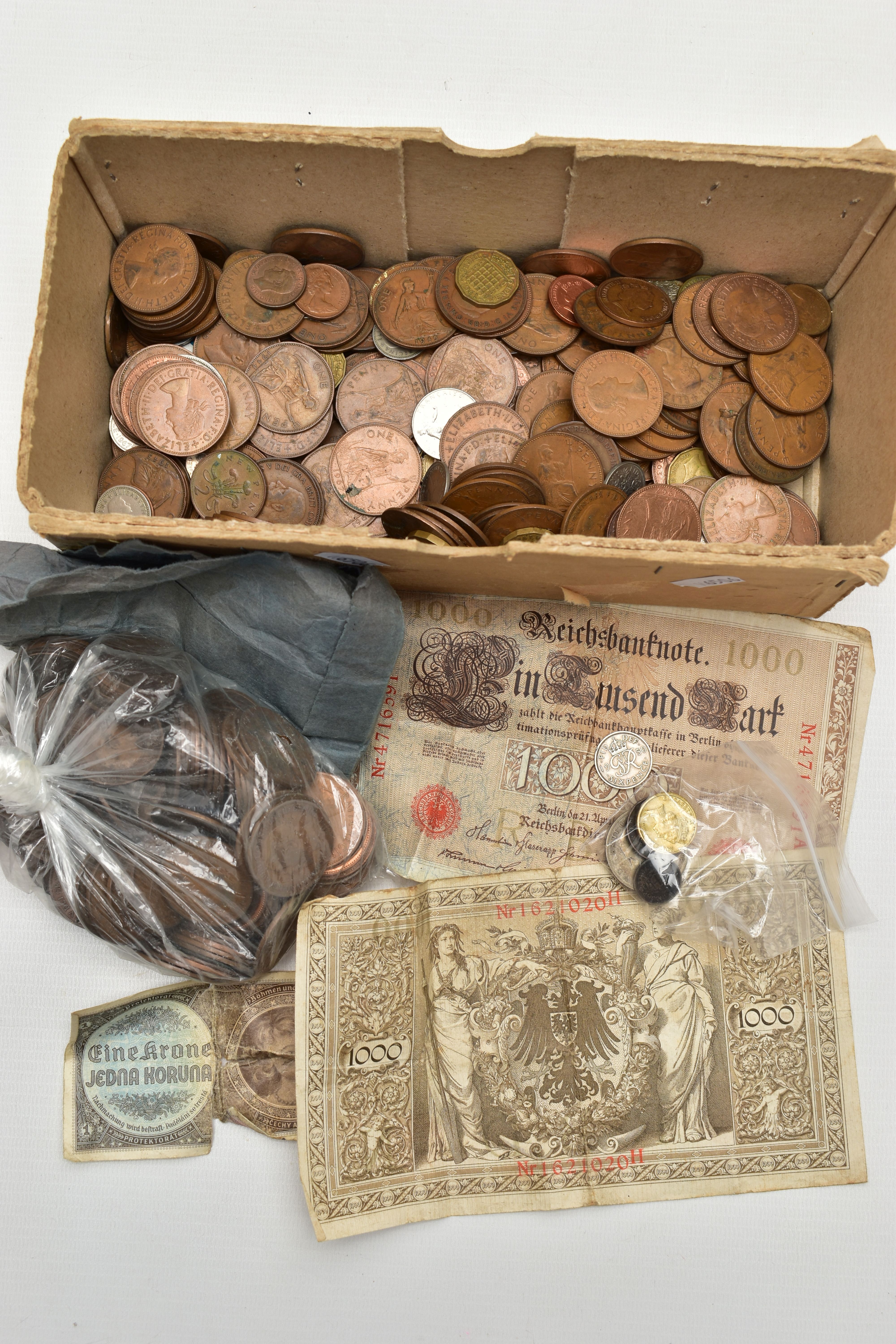 A SMALL BOX OF MIXED COINAGE, to include a couple of early German inflation banknotes with lots of