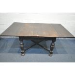 AN EARLY 20TH OAK DRAW LEAF DINING TABLE, on cross framed legs, extended length 183cm x closed