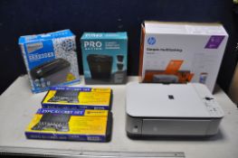 A CANON MP250 ALL IN ONE INKJET PRINTER inside a HP printer box, along with a Ryman VS515C cross cut