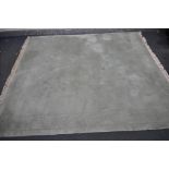 A G H FRITH LTD LARGE RECTANGULAR GREEN RUG, 305cm x 244cm (condition - in need of a clean)