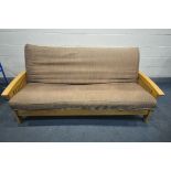 A BEECH FRAMED FUTON/SOFA BED