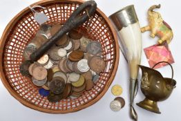 A BASKET OF COINAGE AND OTHER ITEMS, to include a silver South African 2 1/2 shilling coin, 1918