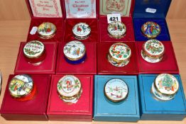 A COLLECTION OF BOXED HALCYON DAYS AND OTHER ENAMEL CHRISTMAS TRINKET BOXES, comprising Halcyon Days