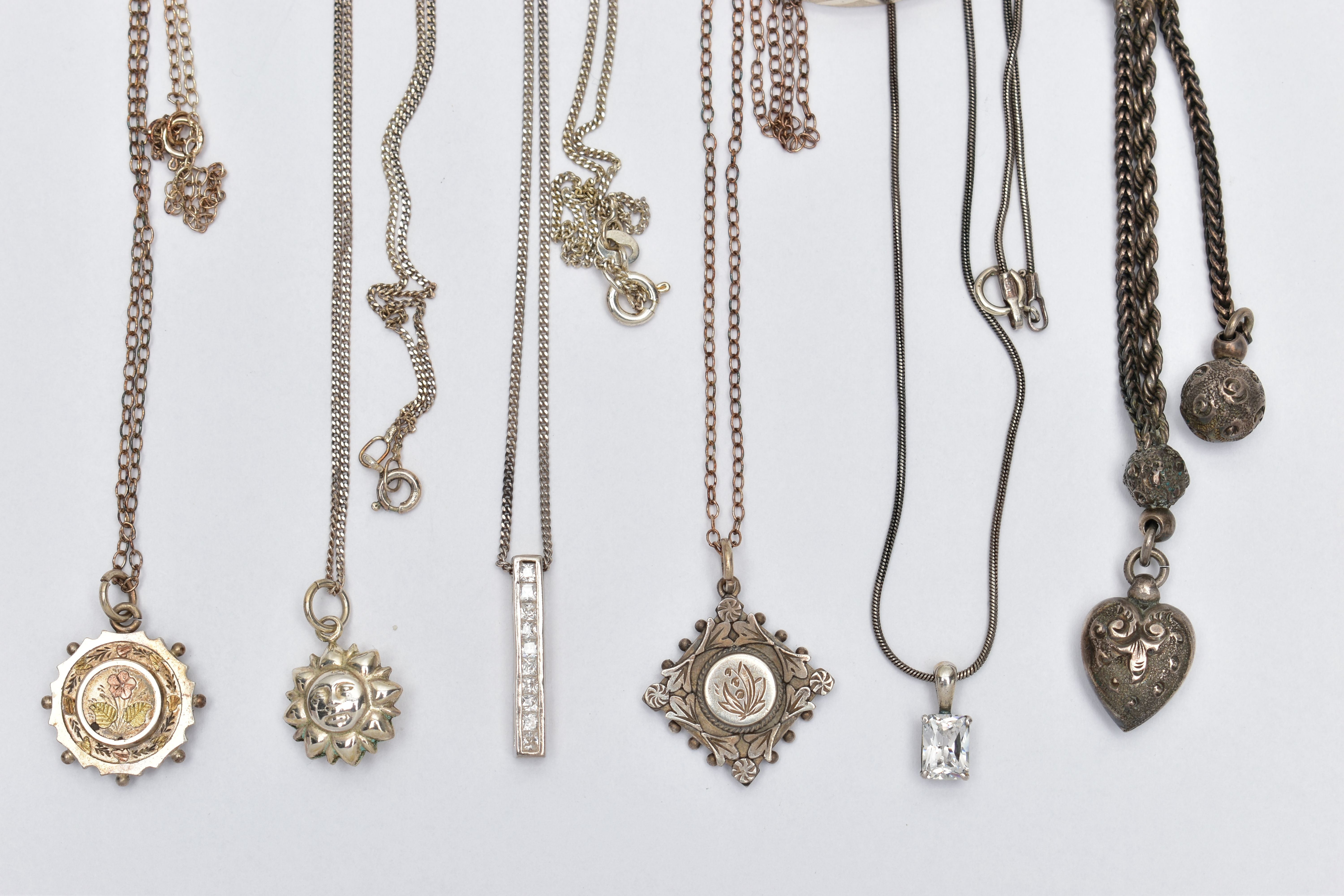 A SELECTION OF SILVER AND WHITE METAL JEWELLERY, to include a silver Victorian pendant of a circular - Image 4 of 6