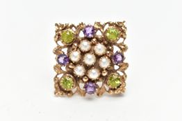 A 9CT GOLD PERIDOT, AMETHYST AND SPLIT PEARL BROOCH, of openwork floral design, the center set