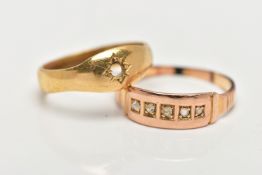 TWO RINGS, the first an AF polished yellow metal star set single stone ring (stone is missing),