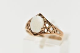 A 9CT GOLD OPAL RING, designed with an oval opal cabochon in a six claw setting, openwork detailed