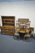 AN OLD CHARM OAK DINING SUITE, comprising a gate leg table, open width 144cm x closed width 50cm x