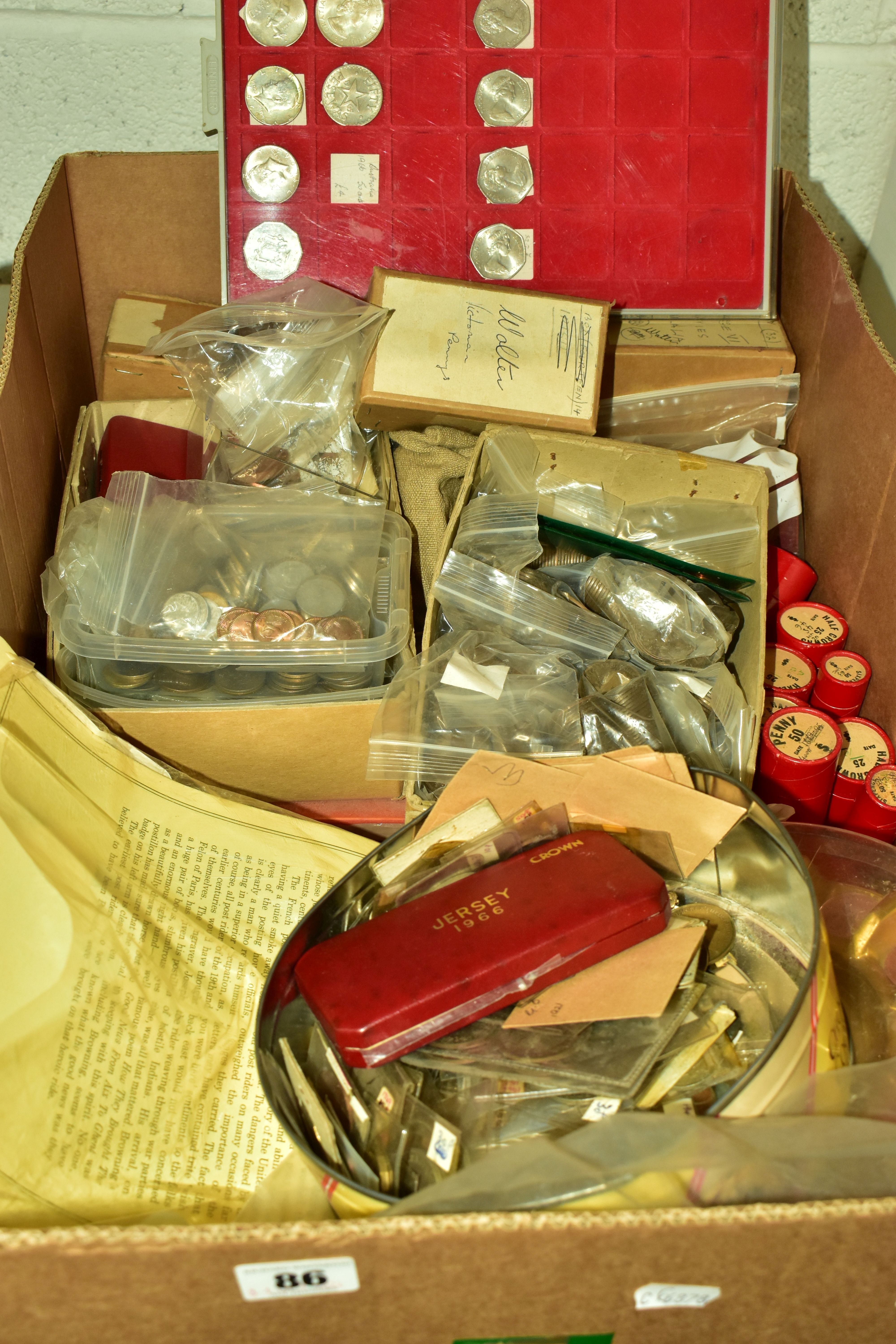 A LARGE CARDBOARD BOX OF COINS FROM DIFFERENT COUNTRIES, to include lots of tubed coins, Pennies
