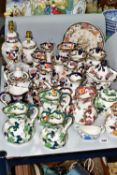 A LARGE QUANTITY OF MASON'S IRONSTONE, comprising three 'Chartreuse' jugs and a tea jar (all
