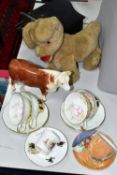 A BESWICK BULL AND CHINA TEA CUPS, comprising a Beswick Hereford Bull 949 in gloss, four Queen's