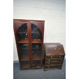 A MODERN MAHOGANY GLAZED TWO DOOR BOOKCASE, enclosing two wooden shelves and two glass shelves,