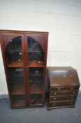 A MODERN MAHOGANY GLAZED TWO DOOR BOOKCASE, enclosing two wooden shelves and two glass shelves,