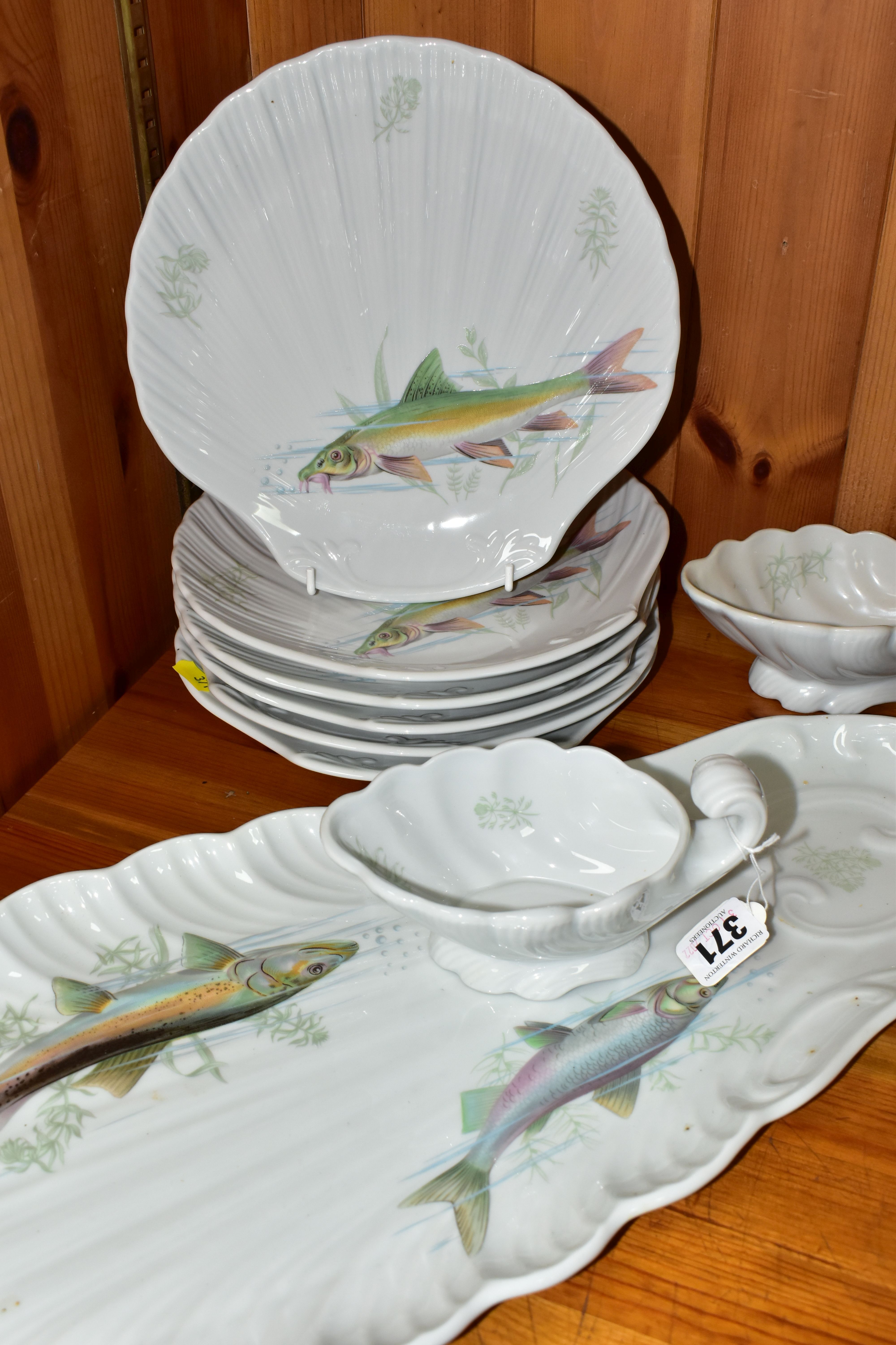 A MODERN PORCELAINE DE SOLOGNE FISH SET, comprising serving platter, two sauce boats and six shell