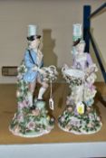 A PAIR OF LATE 19TH CENTURY SITZENDORF FLORAL ENCRUSTED FIGURAL CANDLESTICKS, modelled as a male and