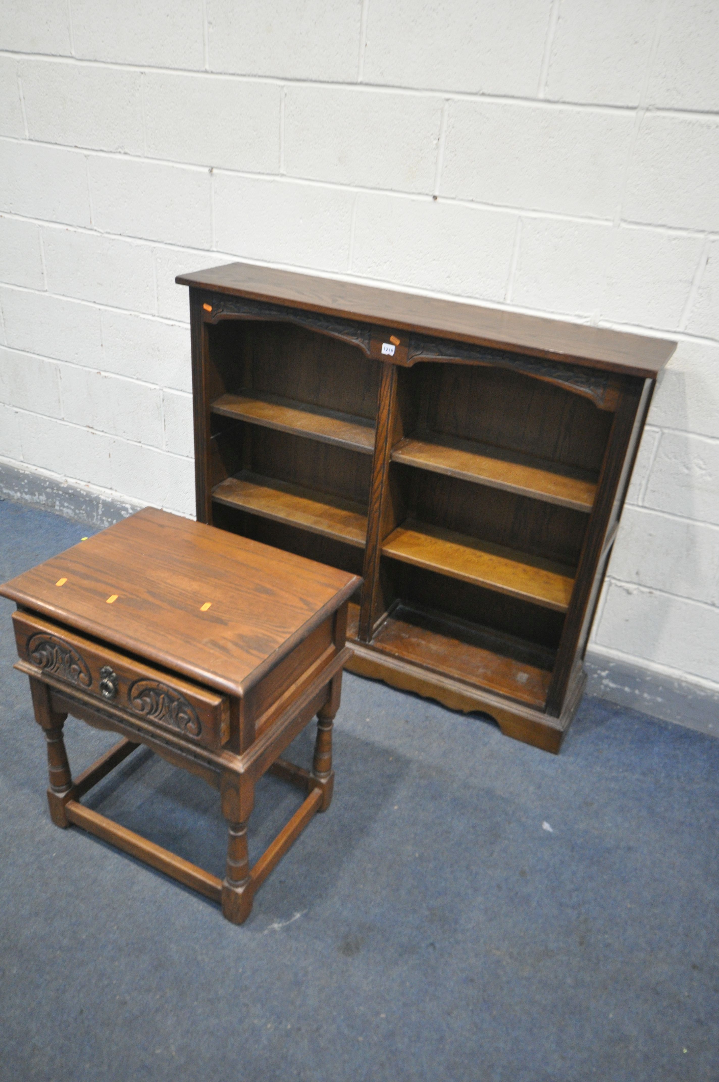 AN OLD CHARM OAK TWIN SIDED OPEN BOOKCASE, width 122cm x depth 28cm x height 106cm, and an Old Charm