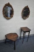 TWO FOLIATE GILT FRAMED WALL MIRRORS, along with an oak cloud shaped coffee table, on triple legs,