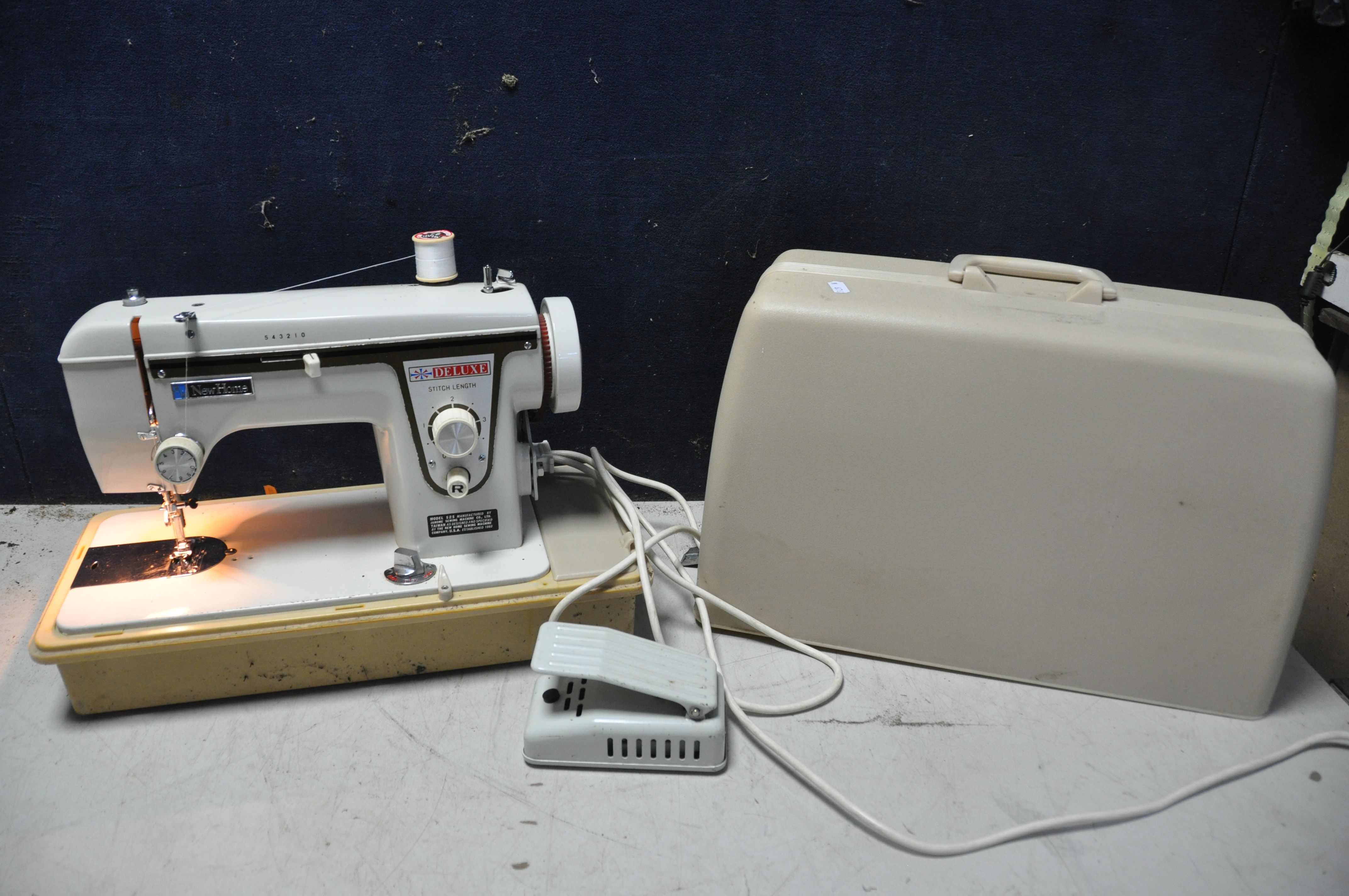 A NEW HOME DELUXE 543210 SEWING MACHINE (PAT pass and working) and a small tubular frame children'