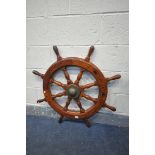 A VINTAGE STAINED SHIPS WHEEL, with a Danish plaque owned by V Nielsen, diameter 86cm