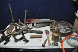 A SELECTION OF VINTAGE TOOLS to include four vintage scythes, vintage saws, two pairs of loppers,
