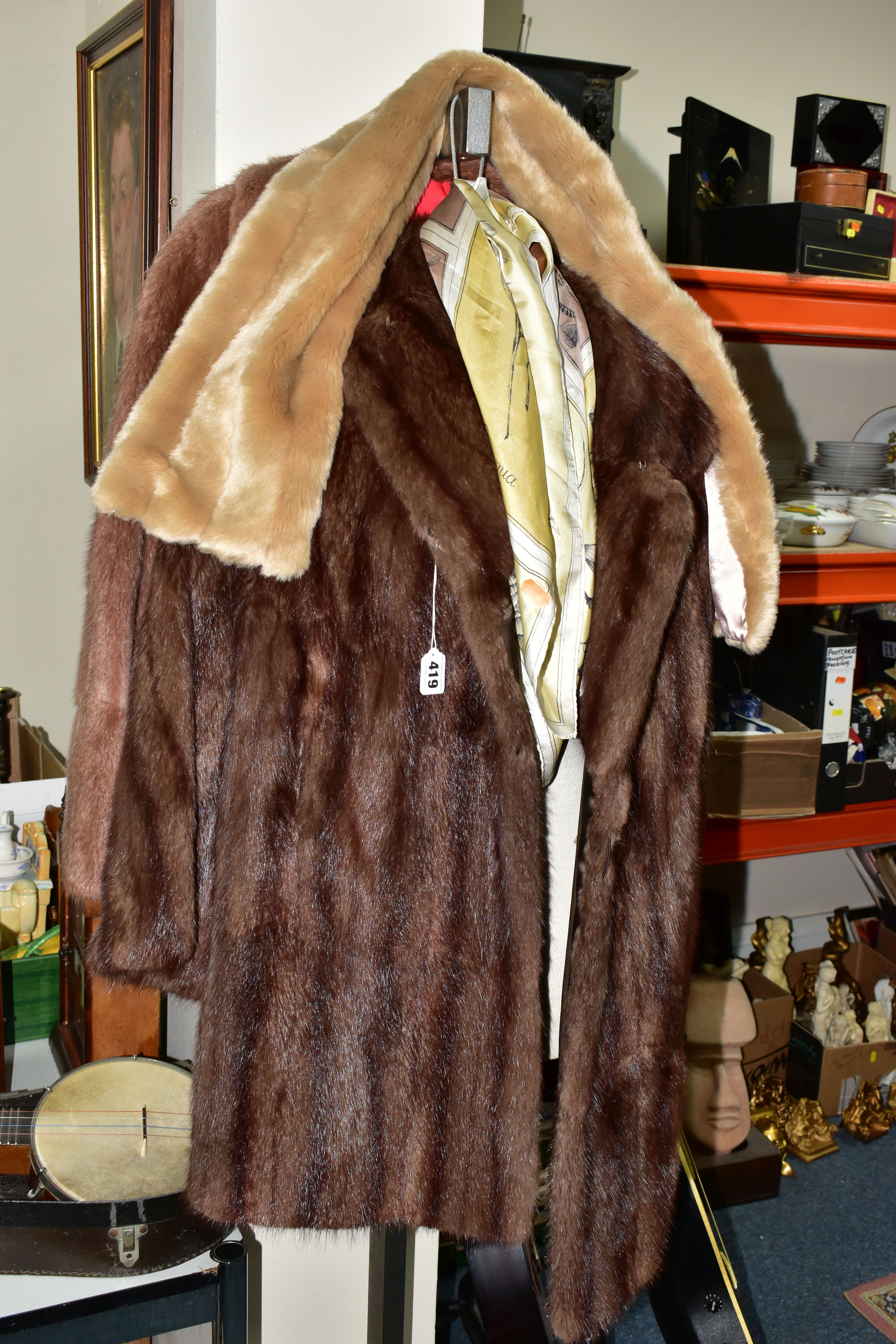 TWO UNBRANDED FURS AND WALKING STICKS ETC, comprising a brown fur coat, a light brown jacket, a faux