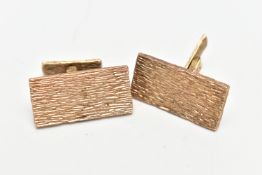 A PAIR OF 9CT ROSE GOLD CUFFLINKS, rectangular in form with bark effect design, approximate