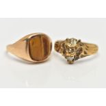 TWO 9CT YELLOW GOLD GEM SET RINGS, to include a ring designed as a lion's head, with a colourless