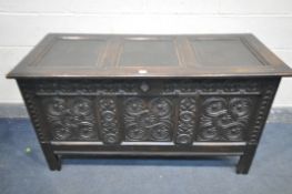 A GEORGIAN OAK COFFER, with paneled hinged lid, front with carved panels, length 135cm x depth