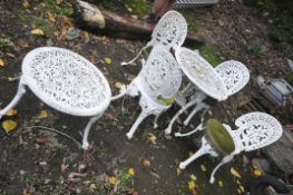 A WHITE PAINTED ALUMINIUM GARDEN TABLE 67cm in diameter, four similar chairs and similar circular