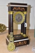 A BLACK EBONISED PORTICO CLOCK, with inlaid floral decoration and banding, the dial having Roman