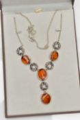 A COPAL AMBER NECKLACE, four oval copal amber stones collet set in a white metal necklet,