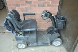 AN A.C.L. MOBILITY DISABILITY SCOOTER with charger and key but Spares or Repairs as battery doesn'
