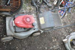 A HONDA IZY GCV160 PETROL LAWN MOWER (engine pulls freely and starts) Condition Front wheel bent