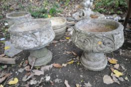 A PAIR OF COMPOSITE GARDEN URNS with scrolled detail to side height 45cm along with two other