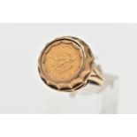 A 9CT GOLD MEXIAN COIN RING, a 1945 Dos Pesos Mexican coin set within a domed yellow gold mount,