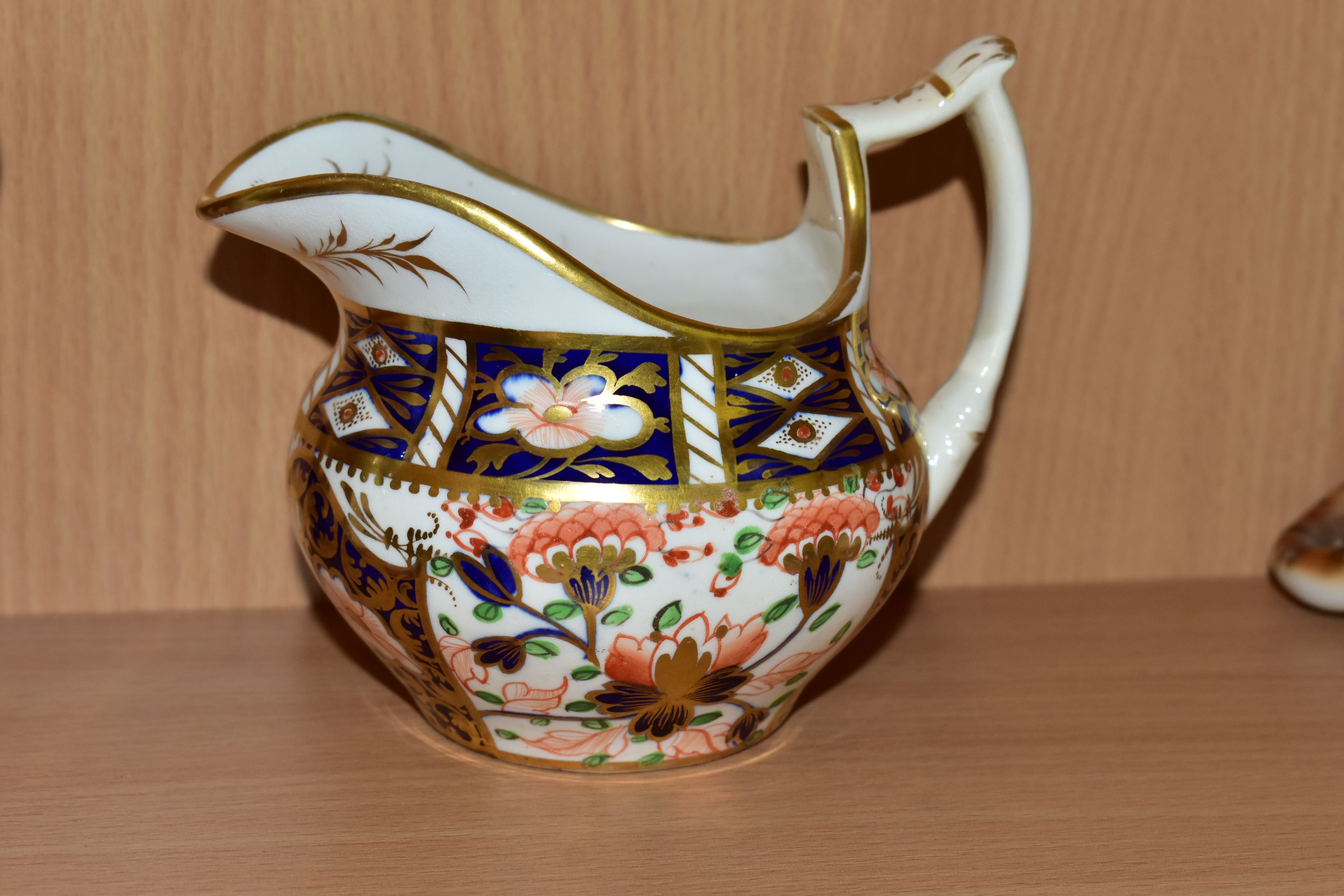 A NINETEENTH CENTURY ENGLISH TEACUP, SAUCER AND CREAM JUG, in an Imari pattern, the teacup having - Image 3 of 4