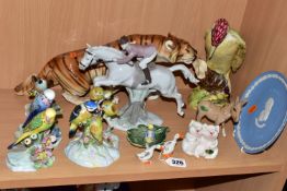 A GROUP OF CERAMIC ANIMAL FIGURES, to include a figure of a jumping horse with rider by Carl