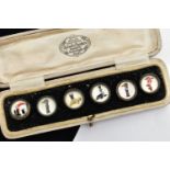 A CASED SET OF SIX GUINNESS DRESS STUDS, six advertising dress studs depicting a seal, tortoise, two