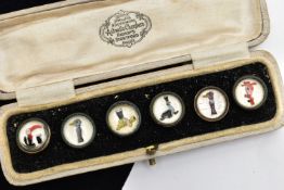 A CASED SET OF SIX GUINNESS DRESS STUDS, six advertising dress studs depicting a seal, tortoise, two