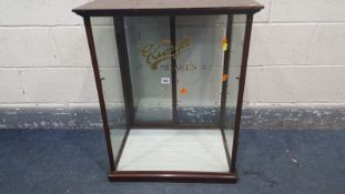 A 20TH CENTURY TABLE TOP DISPLAY CABINET, reading 'Kunzle cakes', opposing sliding double doors,