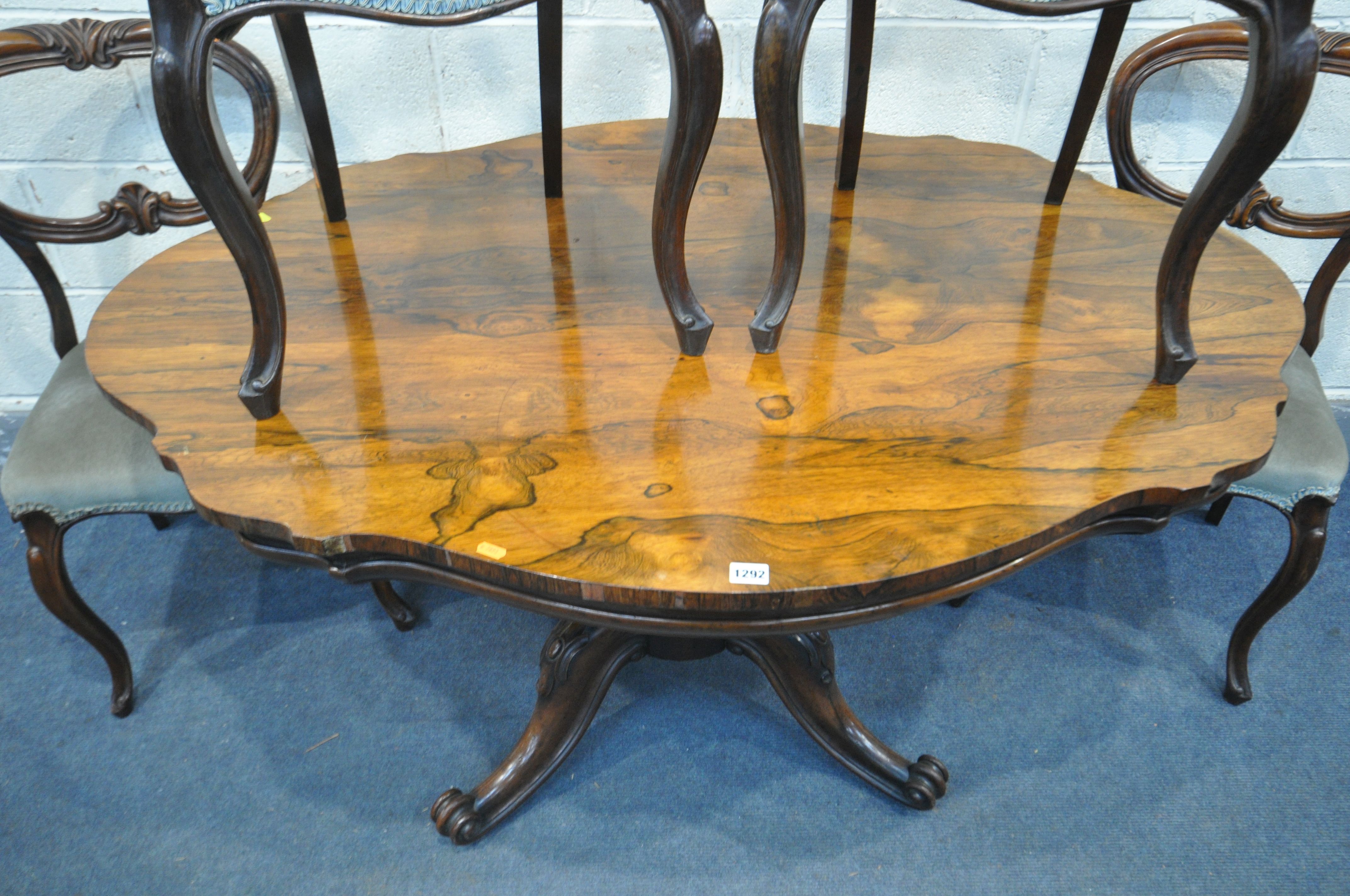 A VICTORIAN ROSEWOOD BREAKFAST TABLE, with a wavy top, on four scrolled legs and casters, length - Image 3 of 3