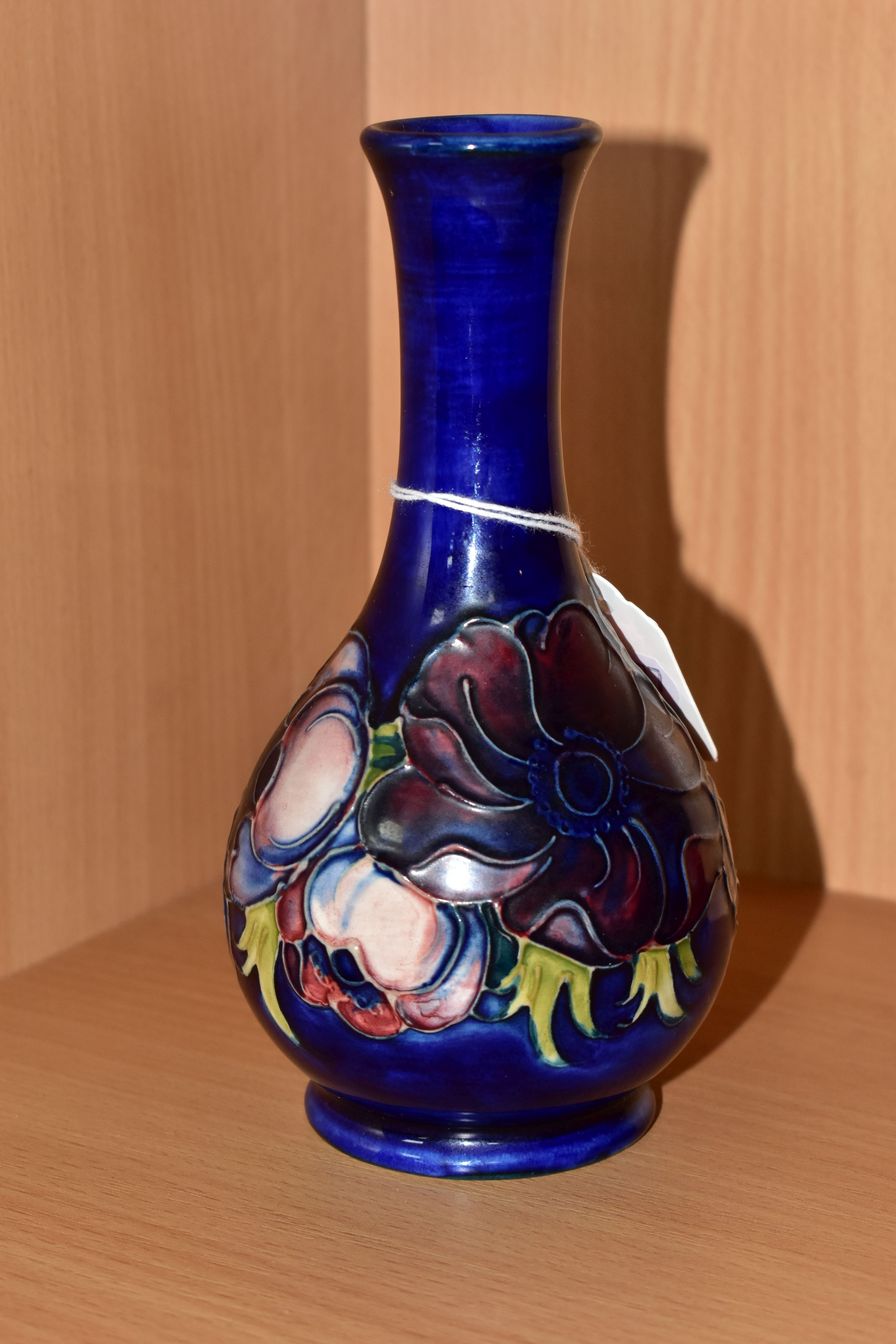 A MOORCROFT POTTERY BUD VASE, tube lined pink and purple Anemone pattern on a blue ground, impressed - Image 2 of 4