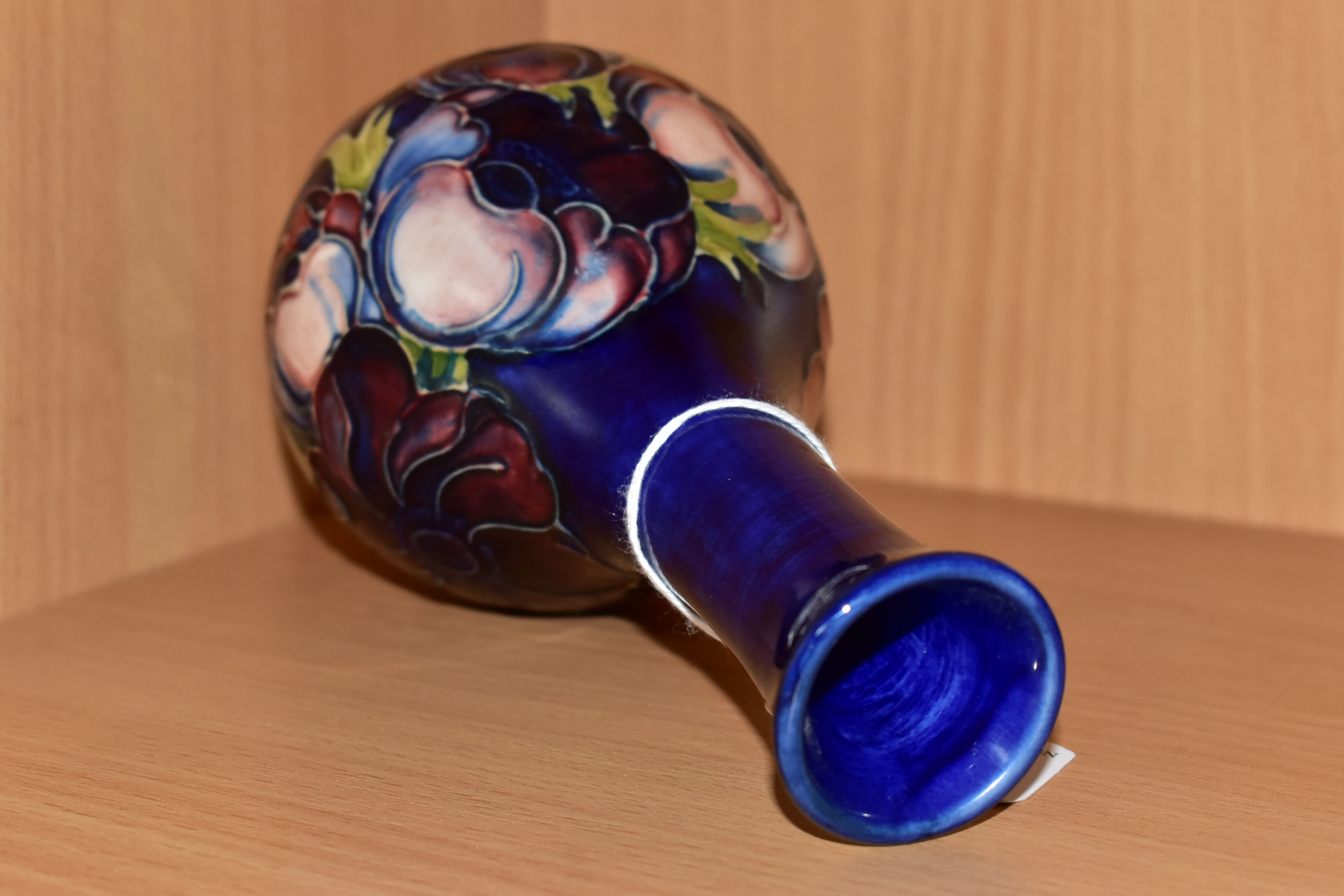 A MOORCROFT POTTERY BUD VASE, tube lined pink and purple Anemone pattern on a blue ground, impressed - Image 3 of 4